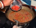 Indian women cooking Indian dish Royalty Free Stock Photo