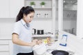 Housewife stirring dough in bowl