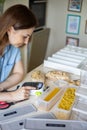 Housewife typing names of pasta kinds use label machine device food product storage organization Royalty Free Stock Photo