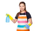 Housewife using rag and detergent spray Royalty Free Stock Photo