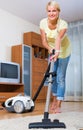 Housewife vacuuming at home Royalty Free Stock Photo
