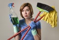 Housewife in washing gloves with cleaning spray bottle broom and Royalty Free Stock Photo