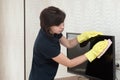 A housewife woman is cleaning an apartment wiping Royalty Free Stock Photo