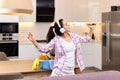 housewife woman singing and cleaning her home, Royalty Free Stock Photo