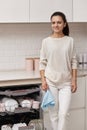 housewife woman standing with towel and using modern dishwasher Royalty Free Stock Photo