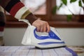 Housewife work, a housewife does her job,iron and ironing board, ironing Royalty Free Stock Photo