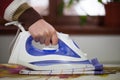 Housewife work, a housewife does her job,iron and ironing board, ironing Royalty Free Stock Photo