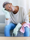 Housework, exhausted and woman cleaner on a sofa taking a break while spring cleaning a home. Tired, stress and African Royalty Free Stock Photo