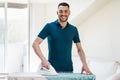 Man ironing shirt by iron at home Royalty Free Stock Photo