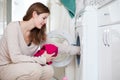 Housework young woman doing laundry