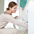 Housework: young woman doing laundry