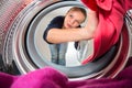 Housework: young woman doing laundry