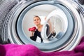 Housework: young woman doing laundry