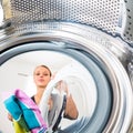 Housework: young woman doing laundry