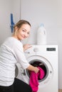 Housework: young woman doing laundry