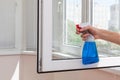 Houseworker clean plastic pvc windows with detergent. Royalty Free Stock Photo