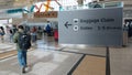 Houston Airport passengers follow directions to baggage claim