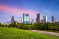 Houston Texas skyline at sunset twilight from park lawn Royalty Free Stock Photo