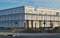 Construction in progress of a generic multiple story building with scaffolding.