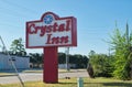 Crystal Inn motel sign by the roadside in Houston, TX.