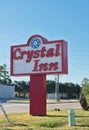 Crystal Inn motel sign by the roadside in Houston, TX.