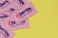 Sweet`N Low packets scattered loosely on a yellow background. Royalty Free Stock Photo