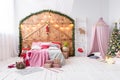 Hovel prepared for children. Beautiful New Year decor of the children room Christmas house.