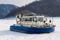 Hovercraft transporter on the ice of river in winter day Royalty Free Stock Photo