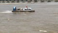 A hovercraft on the sea sails in the wind and waves