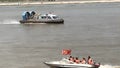 A hovercraft on the sea sails in the wind and waves