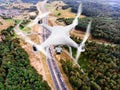 Hovering drone taking pictures of highway in forest, Netherlands Royalty Free Stock Photo