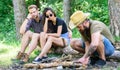 How build bonfire outdoors. Camping weekend leisure. Arrange woods twigs or sticks. Man brutal bearded hipster prepares