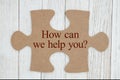 How can we help you text on a cardboard puzzle piece Royalty Free Stock Photo