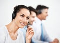 How can we help you today. Positive customer service agents at work while wearing headsets. Royalty Free Stock Photo