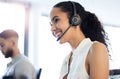 How can I help you today. an attractive young call centre agent sitting in the office with her colleague. Royalty Free Stock Photo