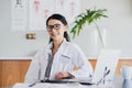 How can I help you today. Cropped portrait of a young female doctor working in her office in the hospital. Royalty Free Stock Photo