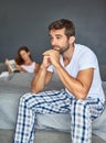 How can I make it up to her. a young couple having marital problems in the bedroom at home. Royalty Free Stock Photo