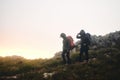 This is how we choose to spend our free time. two friends out hiking in the mountains on a foggy day.