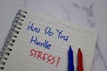 How Do You Handle Stress? write on a book isolated on wooden table