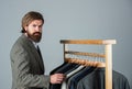 How do you like this. Man clothing in boutique. Man with suit. tailor in his workshop. Handsome bearded fashion man in Royalty Free Stock Photo