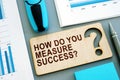 How do you measure success written sign and business report. Royalty Free Stock Photo