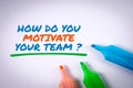 How Do You Motivate Your Team. Text and colored markers on a white background