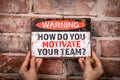 How Do You Motivate Your Team. Warning sign with text