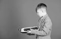 How does a retro typing machine work. Smart child using retro technology. Cute boy with typewriter. Small kid