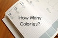 How many calories write on notebook Royalty Free Stock Photo