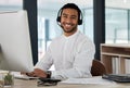 How may I be of service. a young man working in a call center. Royalty Free Stock Photo