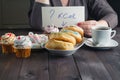 How much calories in sweet donuts, woman hold note with question Royalty Free Stock Photo