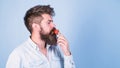 That is how tastes summer. Man handsome hipster with long beard eating strawberry. Hipster enjoy juicy ripe red