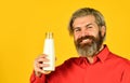 How to be dairy free. Lactose intolerance. Bearded man hold milk bottle. Pasteurized milk. Vegan milk concept. Drink