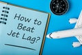 How to beat Jet Lag - Stop Jet Lag symbol with airplane and compas. Business travel concept